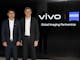 Hu Baishan, Executive Vice President & COO at vivo (left) and Dr. Karl Lamprecht, President and CEO of the ZEISS Group (right)