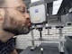 Nobby Assmann kissing a ZEISS measuring machine