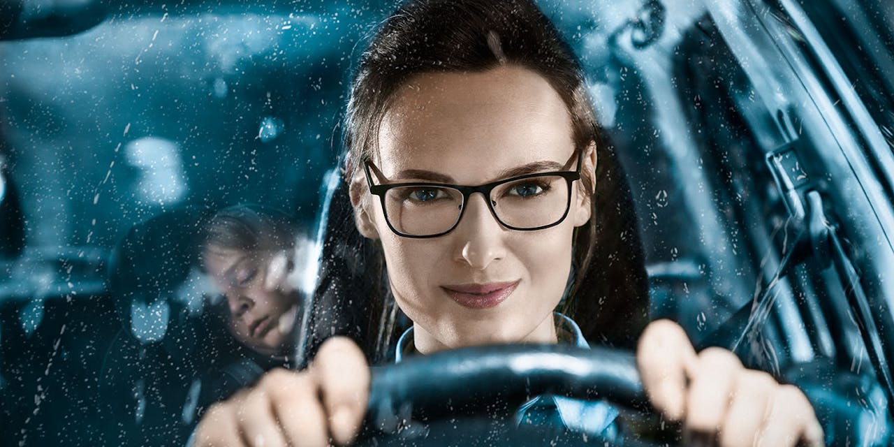 Young woman driving a car